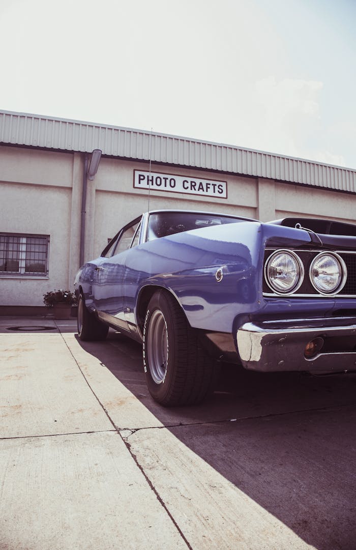 services-04 Classic blue muscle car parked outdoors at Photo Crafts building.